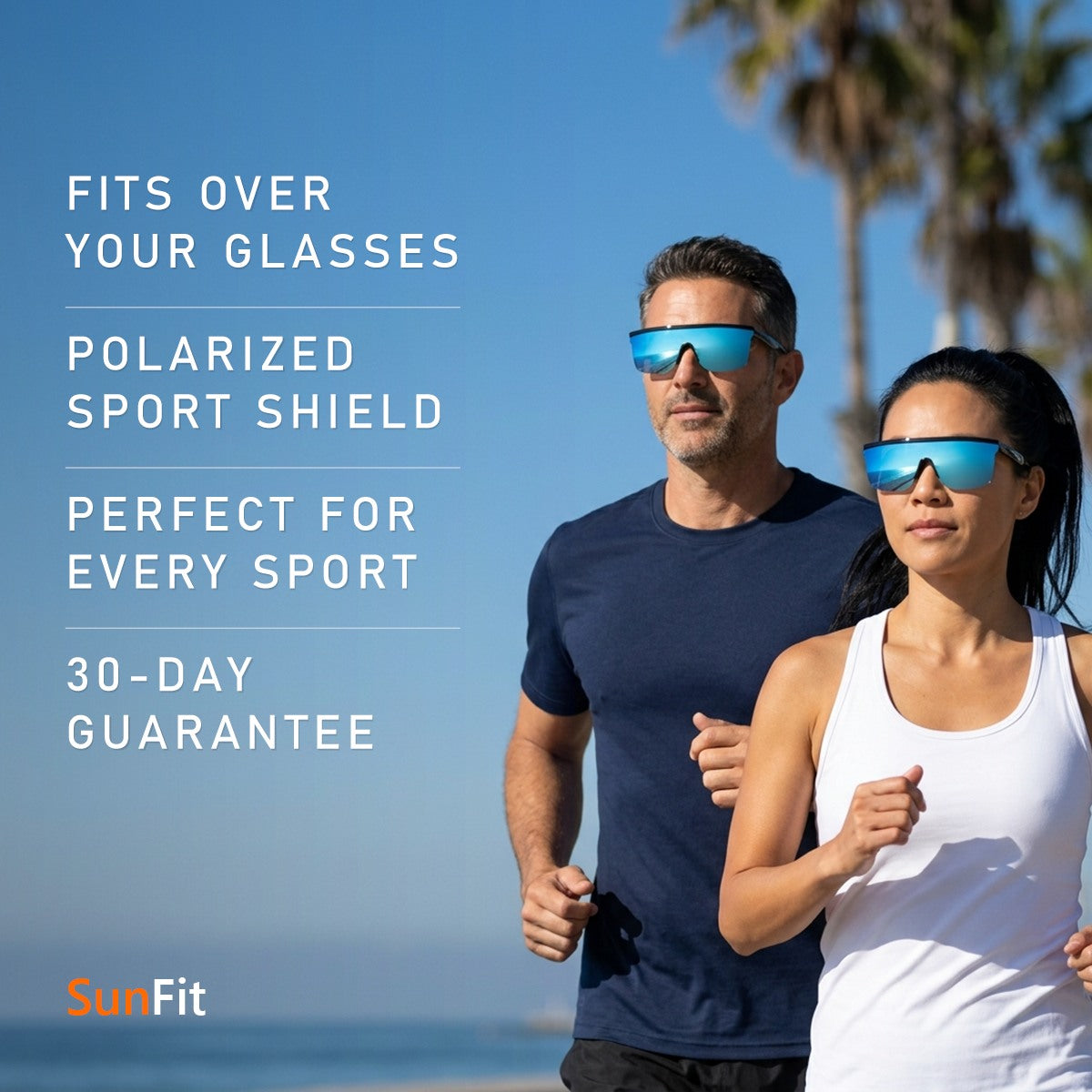 A man and a woman running side by side on a beachfront path, both wearing SunFit Sport in Jet Blue over their prescription glasses: fits over your glasses, polarized sport shield, perfect for every sport, 30-day guarantee